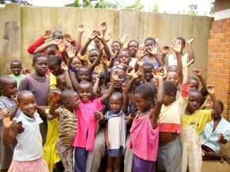 Oasis of Life Orphanage children happy after receiving donations of clothing and other necessities from visiting guests - File Photo