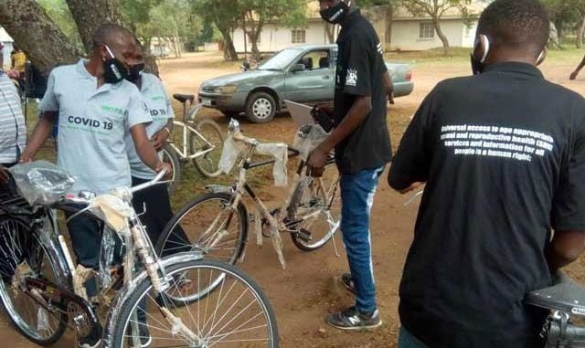 volunteers receiving bicycles
