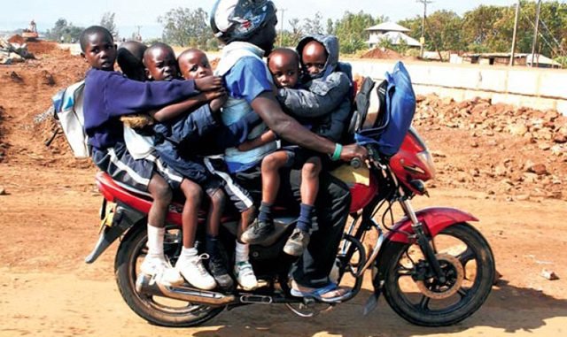 Boda boda rider with school kids
