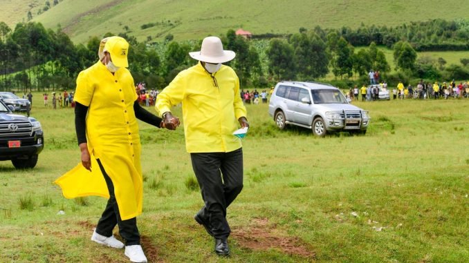 President Museveni holding hands with first lady Janet Museveni