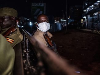 Ugandan police patrol at night to enforce curfew during height of the lockdown